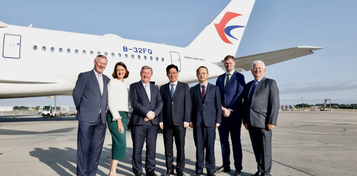 Officials beside a China Eastern Airbus A350