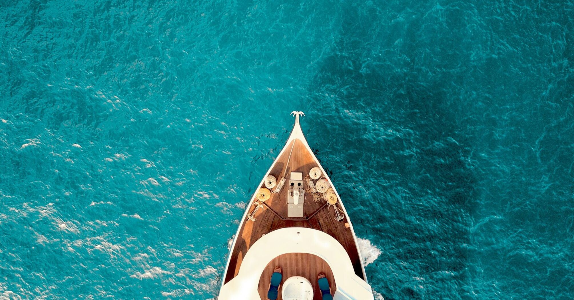 Private yacht sailing across turquoise Mediterranean waters