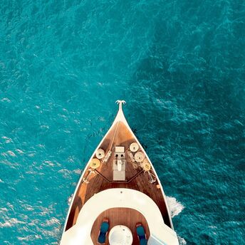 Private yacht sailing across turquoise Mediterranean waters