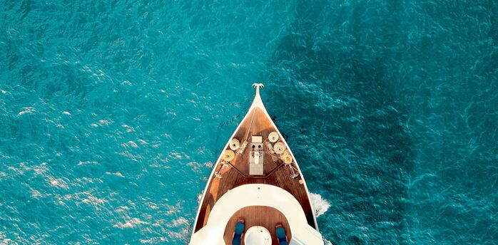 Private yacht sailing across turquoise Mediterranean waters