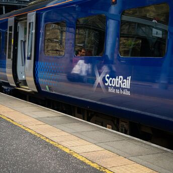 ScotRail train waiting at a station platform