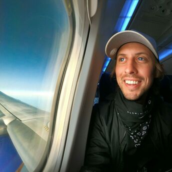 Passenger seated beside an aeroplane window