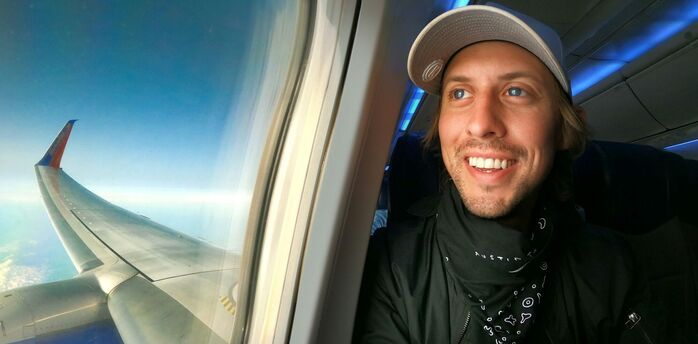 Passenger seated beside an aeroplane window
