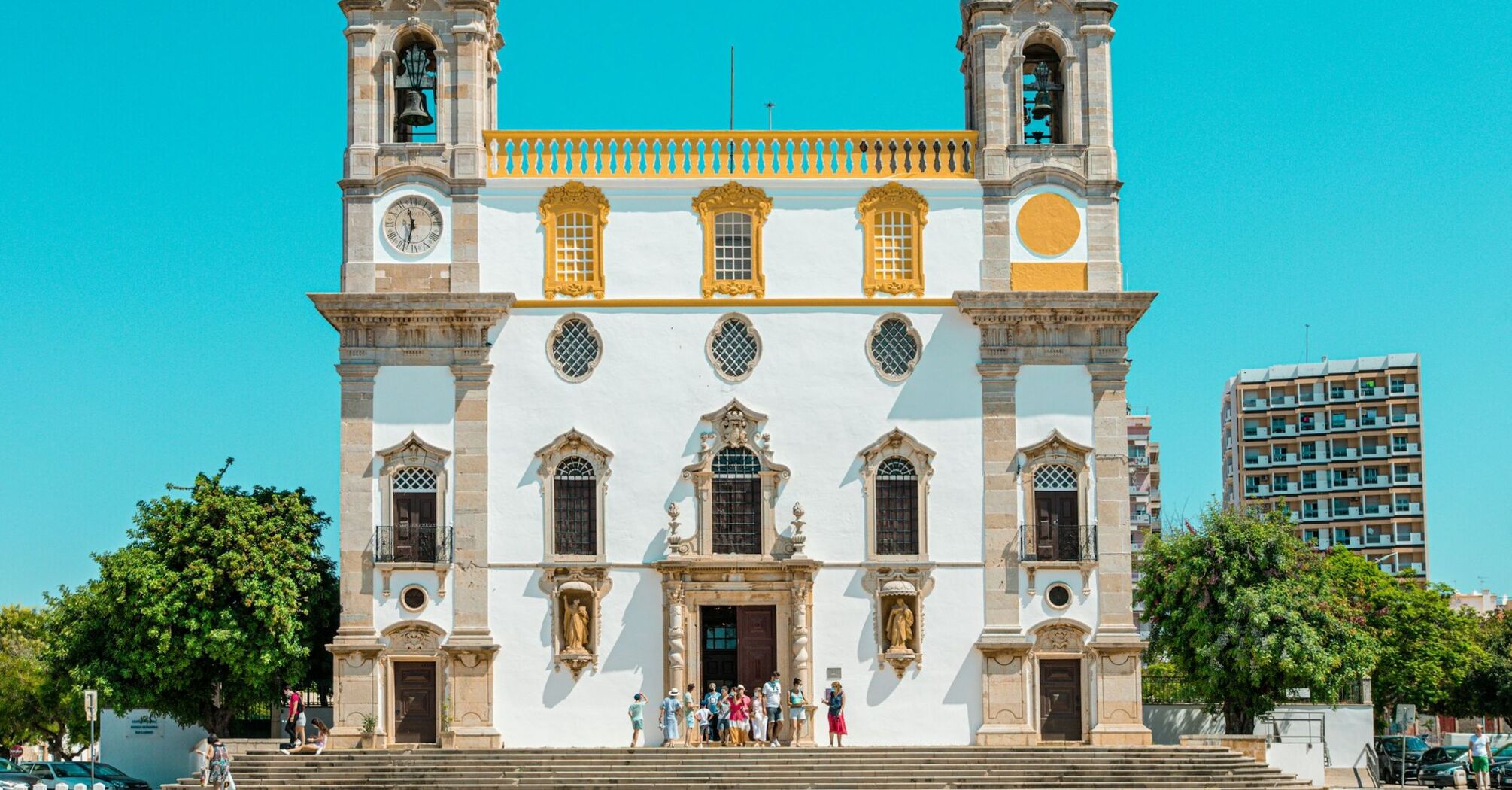 Historic church in Faro under a clear blue sky