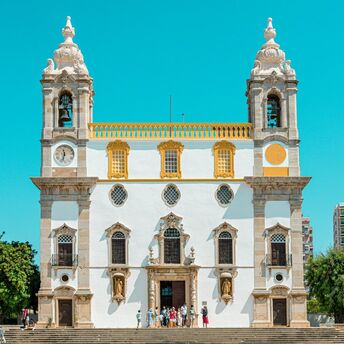 Historic church in Faro under a clear blue sky