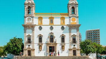 Historic church in Faro under a clear blue sky