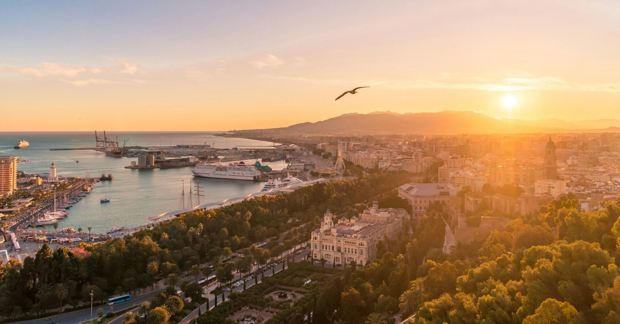 Sunset over Málaga harbour and city centre