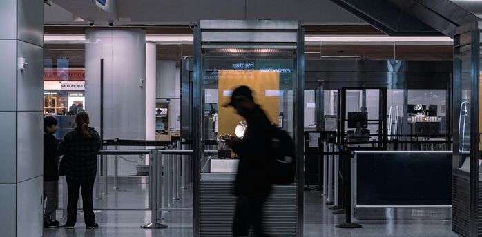 Passenger at airport security screening