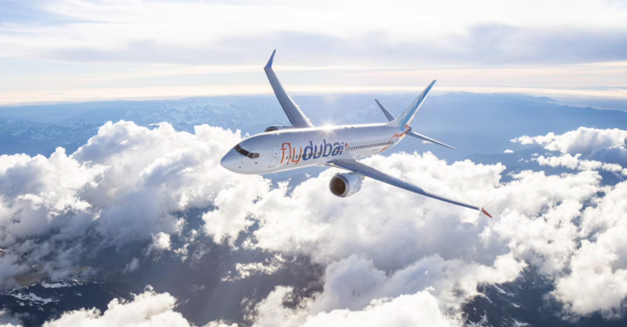 flydubai aircraft flying above the clouds