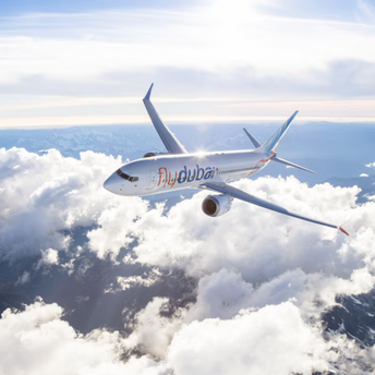flydubai aircraft flying above the clouds