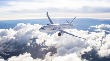 flydubai aircraft flying above the clouds