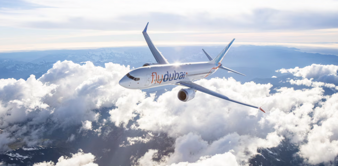 flydubai aircraft flying above the clouds