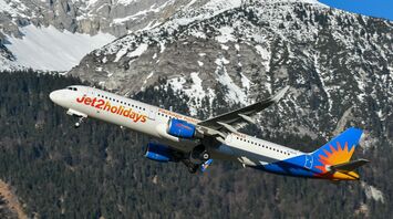 Jet2 aircraft flying over snow-covered Alps