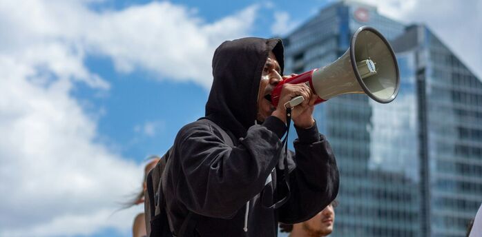 Protester speaking through a megaphone