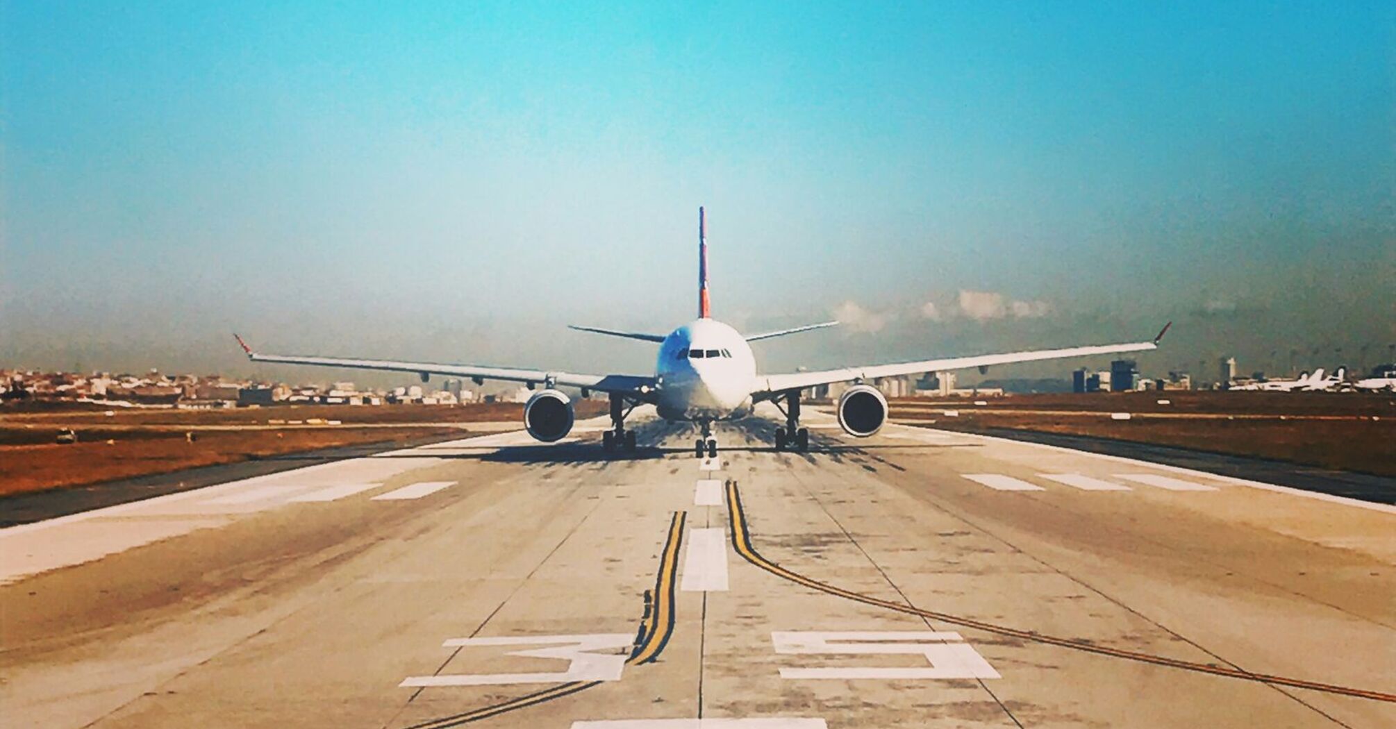 Aircraft taxiing on an airport runway