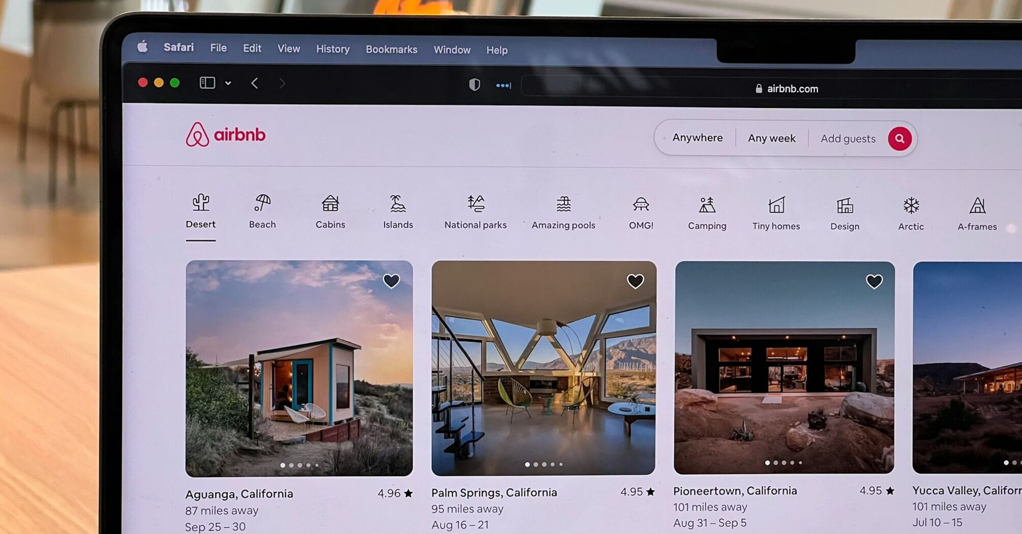 Airbnb accommodation listings on a laptop