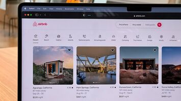 Airbnb accommodation listings on a laptop