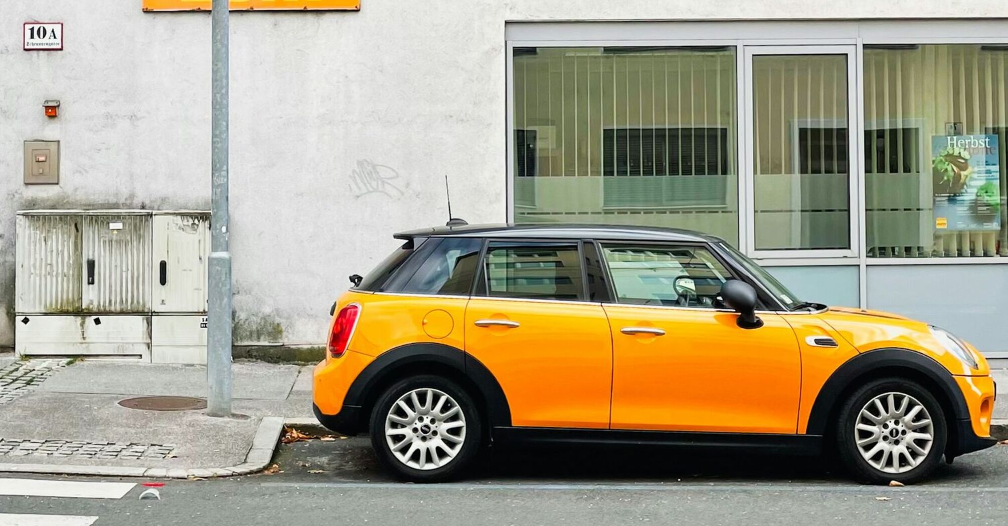 Yellow car parked on a Salzburg street