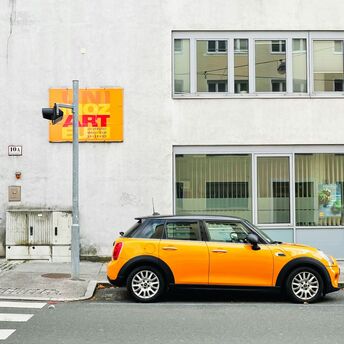 Yellow car parked on a Salzburg street