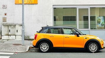 Yellow car parked on a Salzburg street