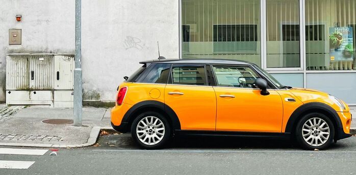 Yellow car parked on a Salzburg street
