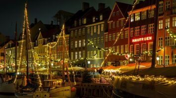 Copenhagen Nyhavn harbour lit up at night