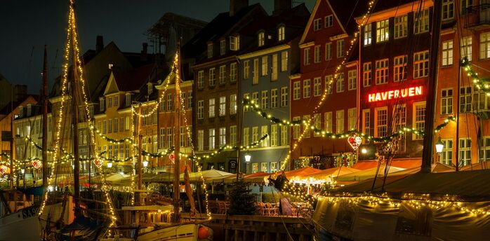 Copenhagen Nyhavn harbour lit up at night