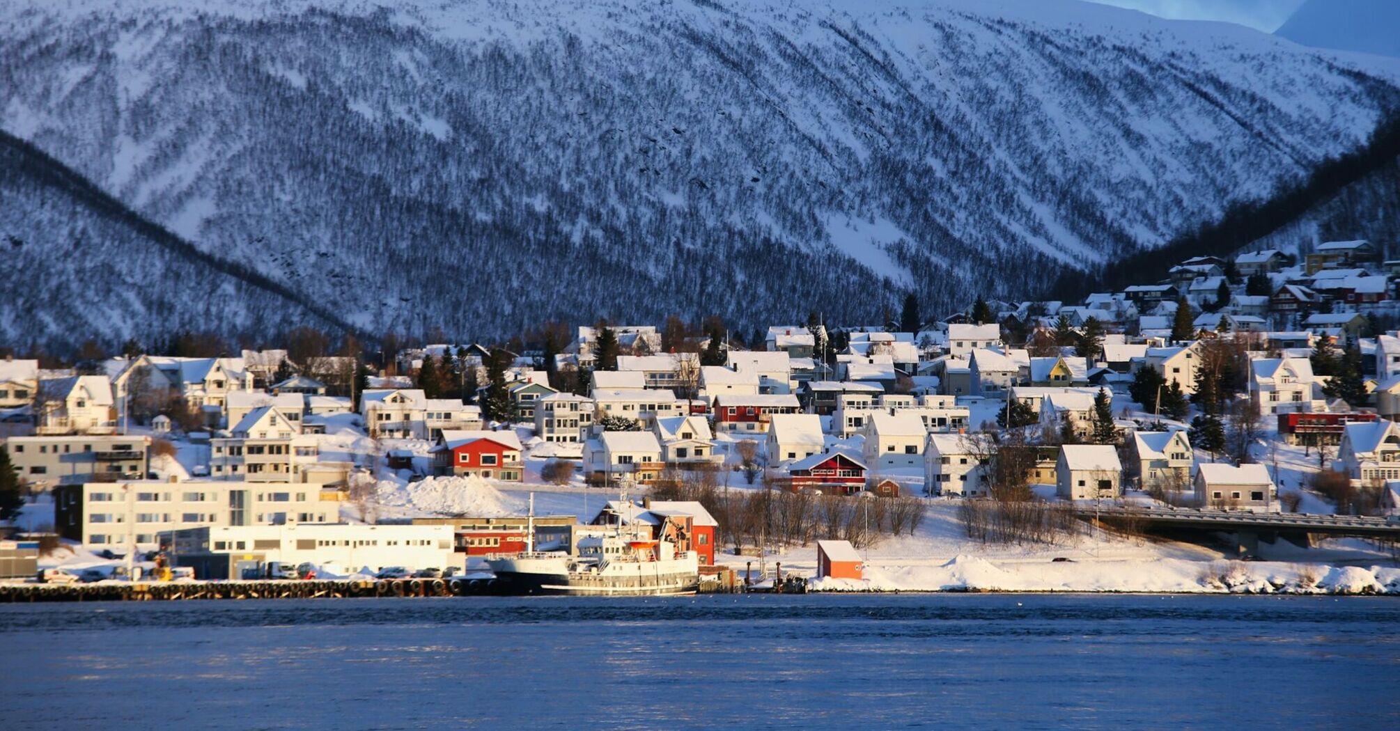 Snow-covered Tromsø waterfront in winter