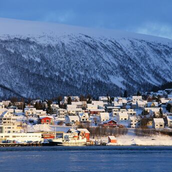 Snow-covered Tromsø waterfront in winter