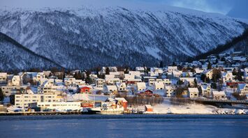 Snow-covered Tromsø waterfront in winter