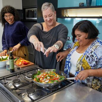 Travellers taking part in a cooking class