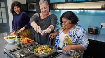 Travellers taking part in a cooking class