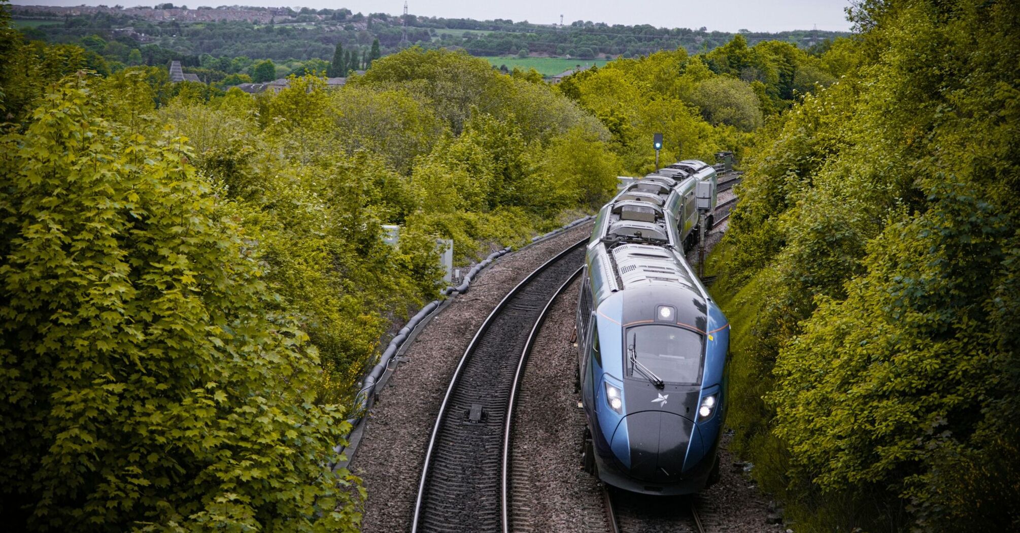 High-speed passenger train travelling through the UK