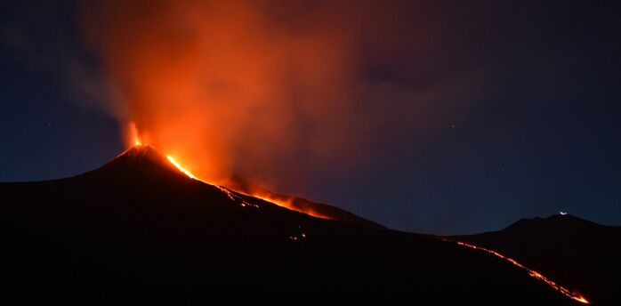 Mount Etna erupting at night in Sicily