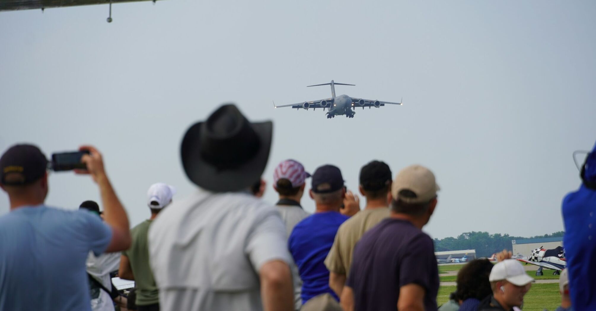 Plane spotters watching an approaching aircraft