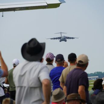 Plane spotters watching an approaching aircraft