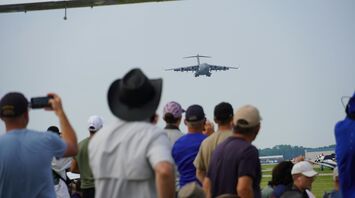 Plane spotters watching an approaching aircraft