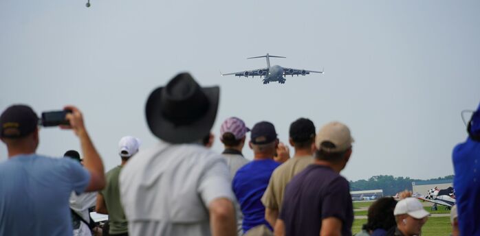 Plane spotters watching an approaching aircraft