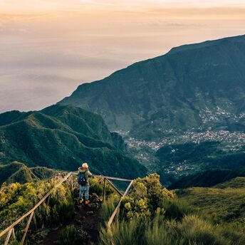Hiker overlooking Madeira’s mountain landscape