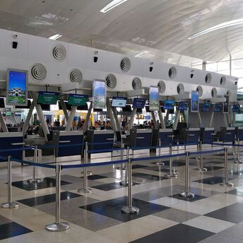 Airport check-in counters with queue barriers