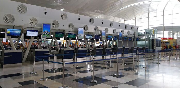 Airport check-in counters with queue barriers