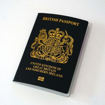 Black British passport on white background