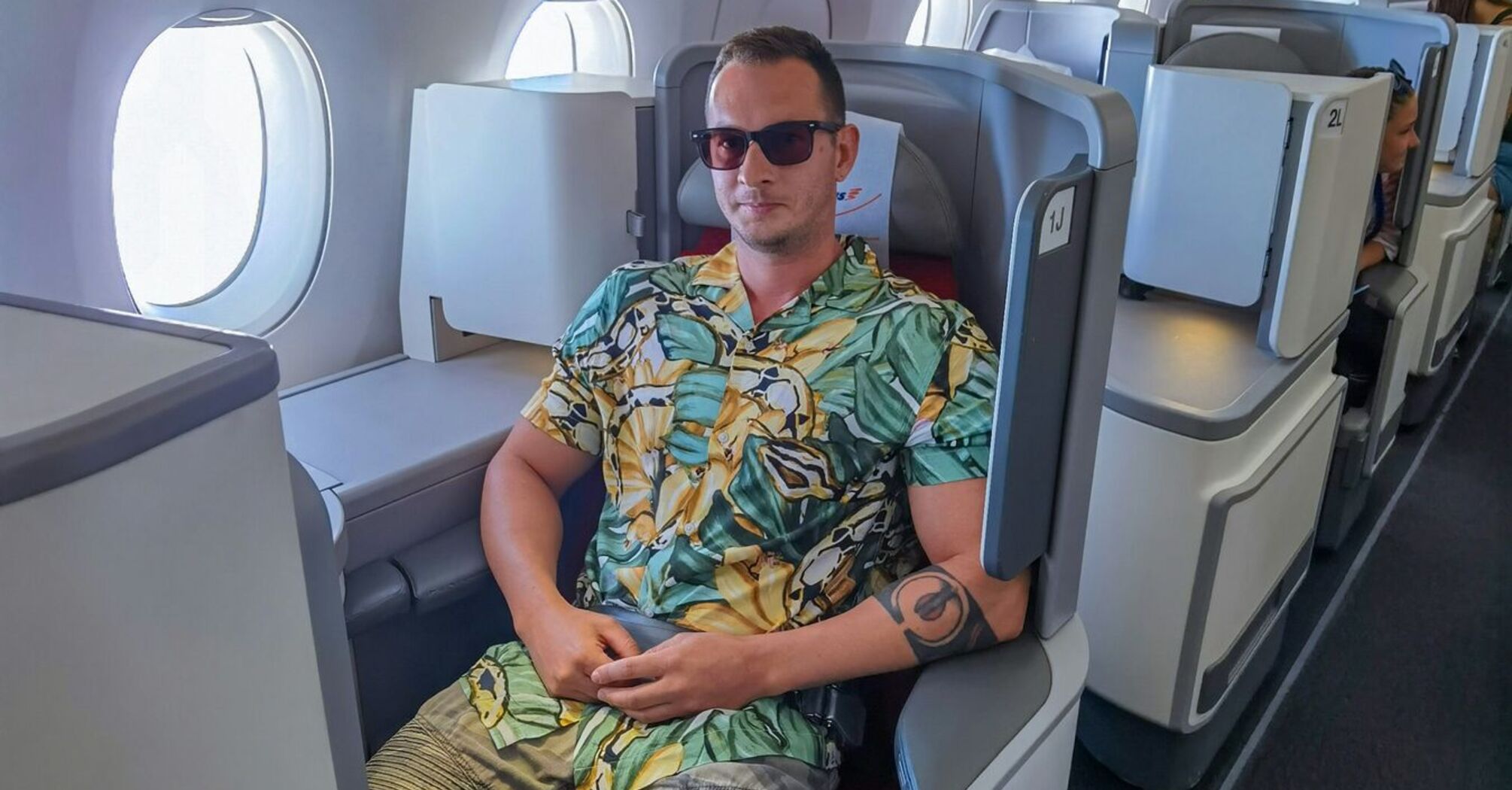 Passenger wearing shorts in an aircraft cabin