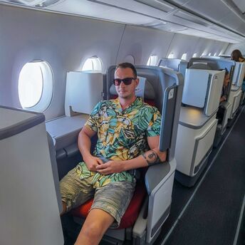 Passenger wearing shorts in an aircraft cabin