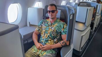 Passenger wearing shorts in an aircraft cabin