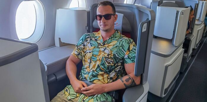 Passenger wearing shorts in an aircraft cabin