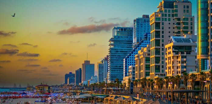 Tel Aviv beachfront and city skyline at sunset