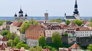 Tallinn skyline with historic churches and red-roofed buildings