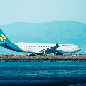Aer Lingus aircraft parked near airport runway