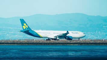 Aer Lingus aircraft parked near airport runway